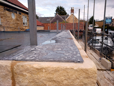 Ext. Day. Pub. Lead coping added at the top of the cavity wall.