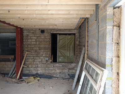 Int. Day. Pub. The removal of the existing, formerly exterior, windows thereby creating access into the newly built room.