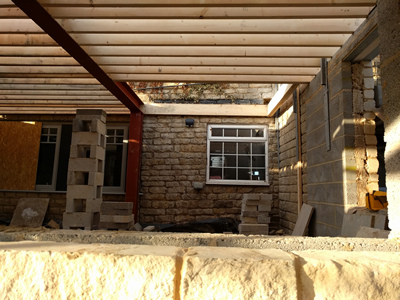 Ext. Day. Pub. Joists over old window.