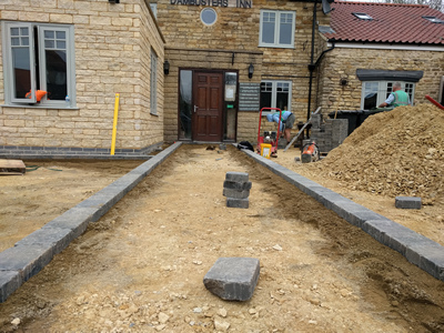 Ext. Day. Pub. Commencing the laying of Setts.